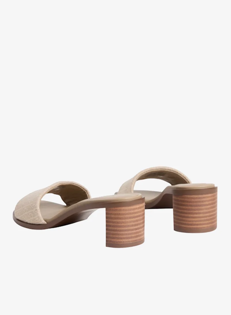 Calvin Klein Silver Mink All-Over CK Monogram Block Heel Mules for Women | Best Price UAE